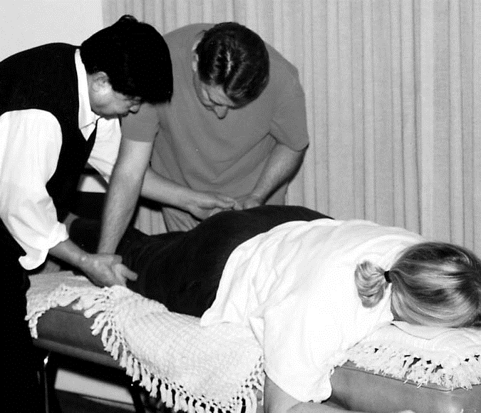 instructing student qi healer/LMT in qi induction therapy